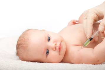 Doctor vaccinating calm baby