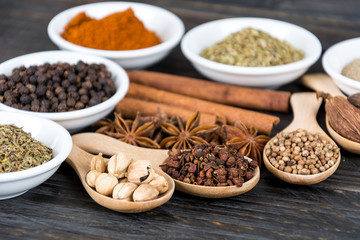 Spices and herbs in  bowls.