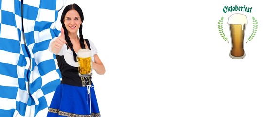 Composite image of pretty oktoberfest girl holding beer tankard