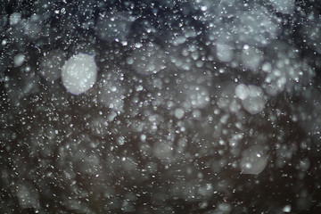 texture of white rain drops on a black background for a filter on the photo