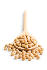 uncooked chickpeas in wooden spoon