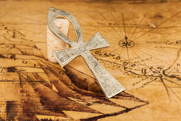 old cross on old map background