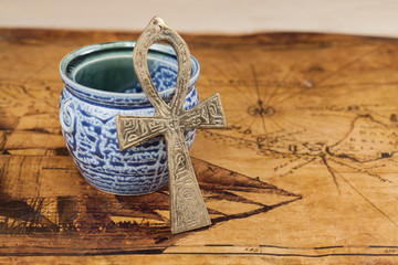 old cross on old map background