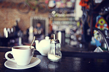 cup of tea at a cafe blurred background