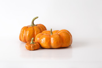 Three orange halloween pumpkin gift on white background