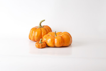 Three orange halloween pumpkin gift on white background.