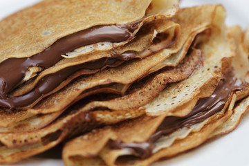 thin crepes or blinis with chocolate cream