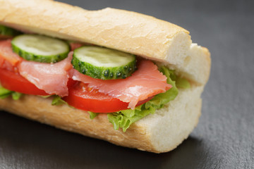 Sandwich with salmon and vegetables
