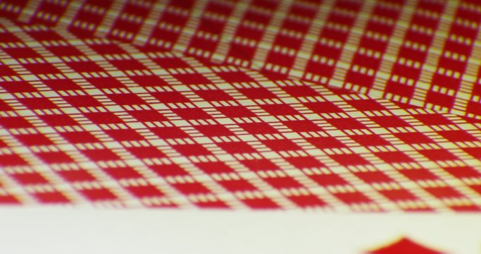 Various playing card background. Loop rotation on the table. Macro shot 4K
