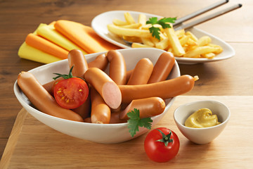 sauseges on a plate with vegetables