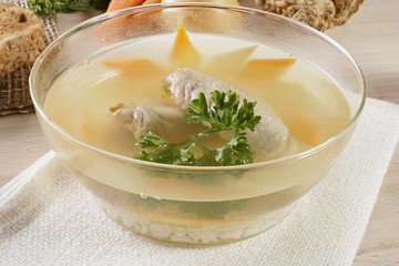 Whole roasted chicken with vegetables and herbs isolated on white