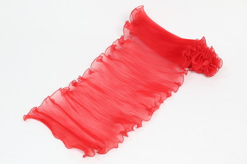 Pressing a red chiffon on a white background.