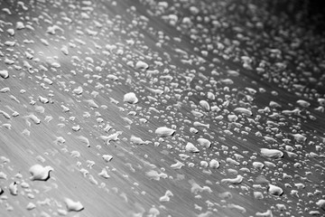 Stainless steel surface with water drops