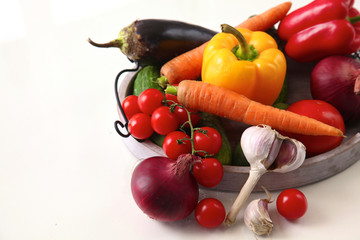 Fresh autumn vegetables on a white background