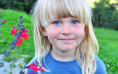 Portrait of a smiling boy with a blonde hair