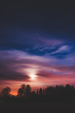 Night landscape and cloudy starry sky