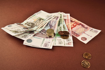 Russian rubles coins on brown background