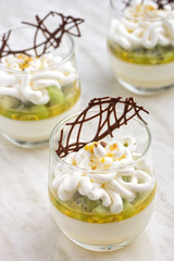 Panna cotta with kiwi, passion fruits and longan