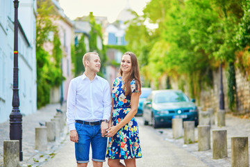 Young romantic couple hugging on Montmartre