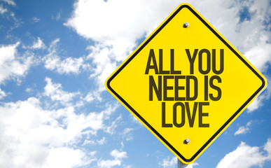 All You Need is Love sign with sky background