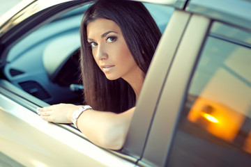 Fototapeta na wymiar Beautiful woman in a car 