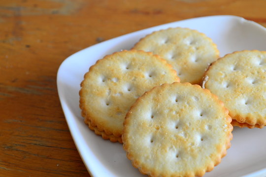 Four Cookie Sandwiches on a white square plate