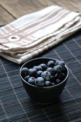 Close-up of black grapes in a  bowl.