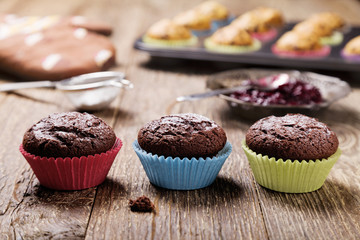 muffins with chocolate in colorful molds