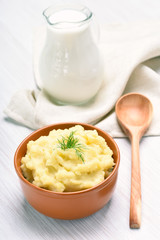 Mashed potato and jug of milk