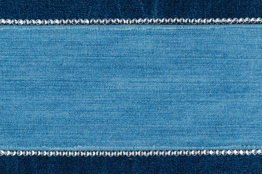 Fashionable background,  jeans and silver  rhinestones