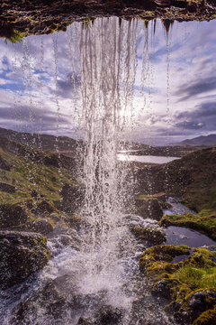 Fototapeta behind small waterfall in Iceland