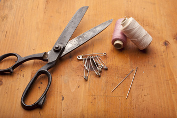 dressmaker shears craft concept with crochet on wooden texture