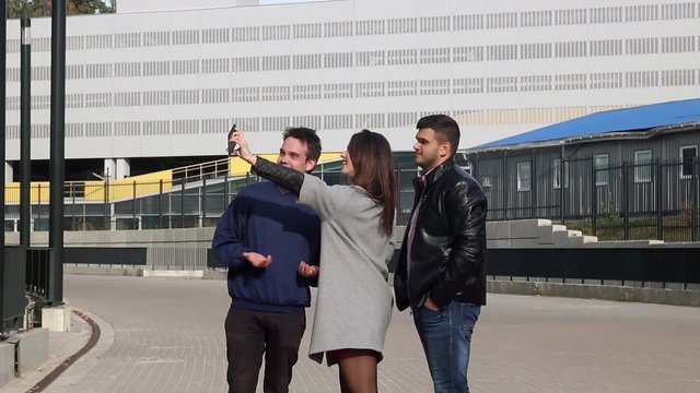 People making selfie near office