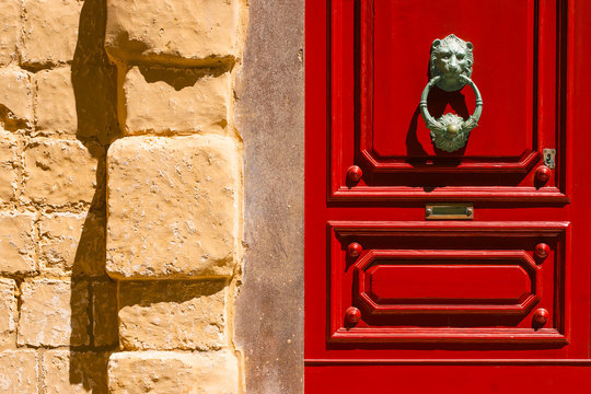 Red maltese door with  old forged handle