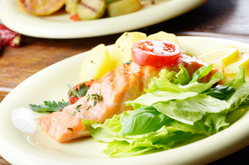 Fried salmon fillet with vegetables