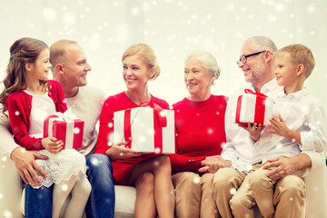 smiling family with gifts at home