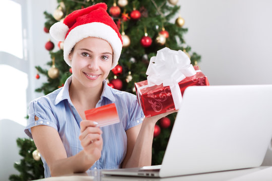 Beautiful woman making purchase online for xmas