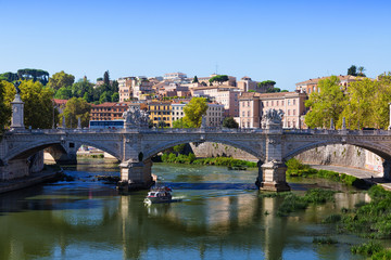Obraz premium View towards the Ponte Sant'Angelo, Vatican and other buildings in Rome during the day