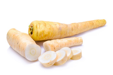 Fresh parsnip roots on a white background
