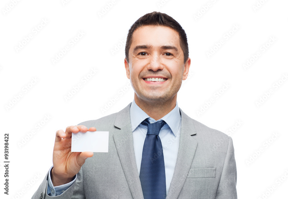 Canvas Prints smiling businessman in suit showing visiting card