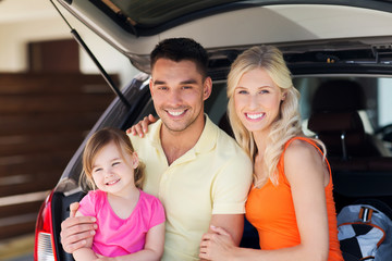 Fototapeta na wymiar happy family with hatchback car at home parking