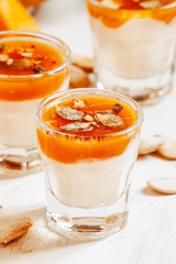 Pumpkin dessert with homemade yogurt and pumpkin seeds in a smal