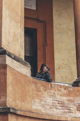 Man taking pictures of architecture at San Luca in Bologna, Ital