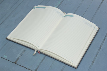 hardcover book on wood background