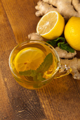 Ginger tea. Ginger, lemon, mint leaves. Selective focus.