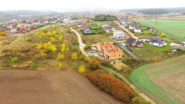 Camera flight over village in urban landscape. Civilization and nature. Environmentally friendly living. 