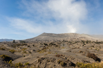 Whispering sands background with Bromo Volcano