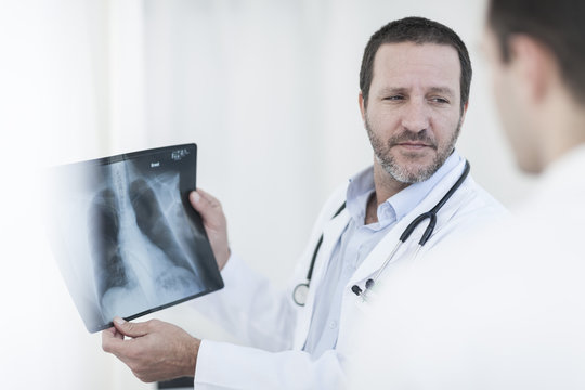 Doctors with x-ray image in a hospital