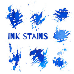Set of blue ink stains with spots and grunge elements isolated on white. Vector.