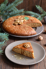 Honey and walnut pie on wooden background